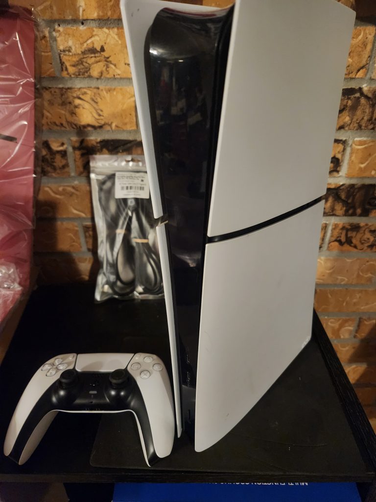 PlayStation 5 Slim digital console with controller and cords